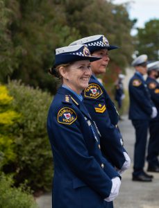 Smiling female officer in formal uniform